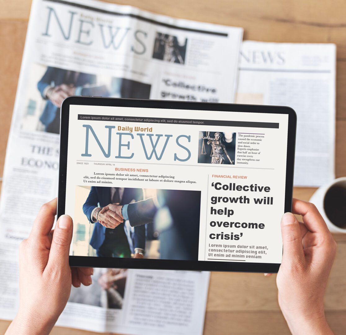 Person reading digital news on a tablet