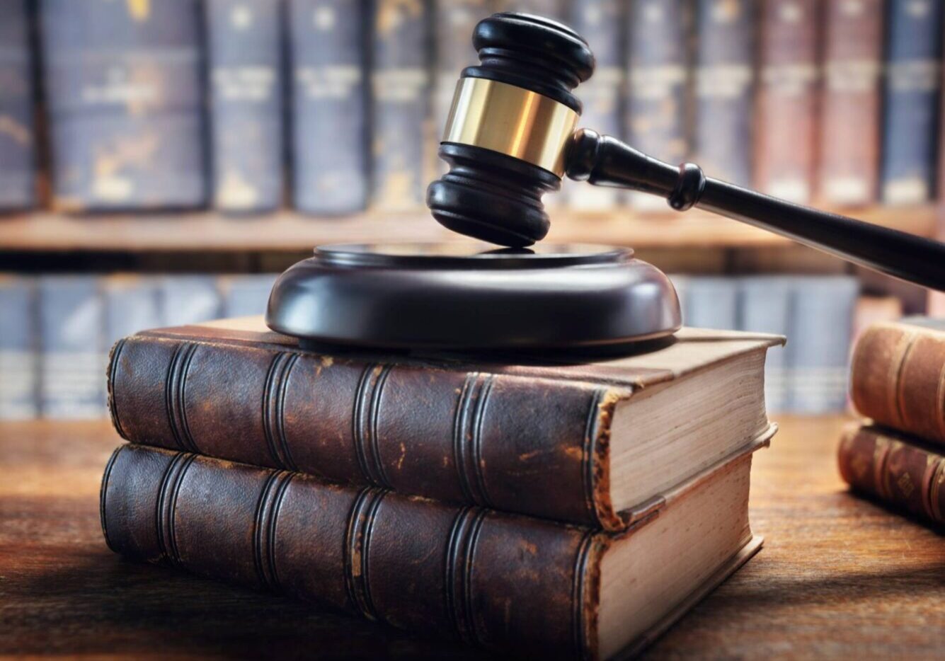 Judge's gavel and legal tomes