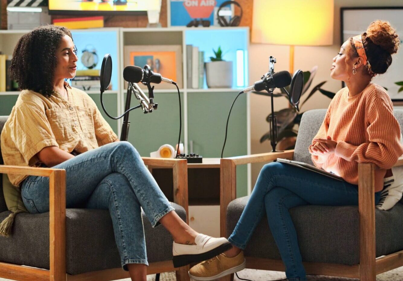 Podcast hosts in a cozy studio